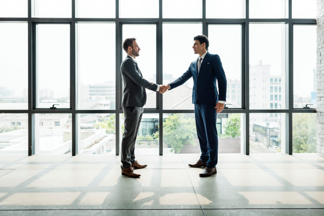 Ralez Connect representative shaking hands with an international supplier partner
